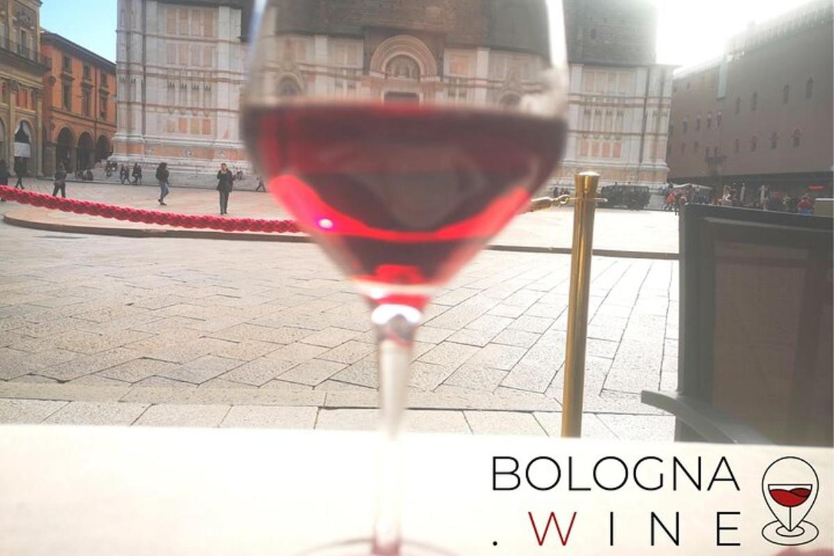 a glass of red wine in front of a building