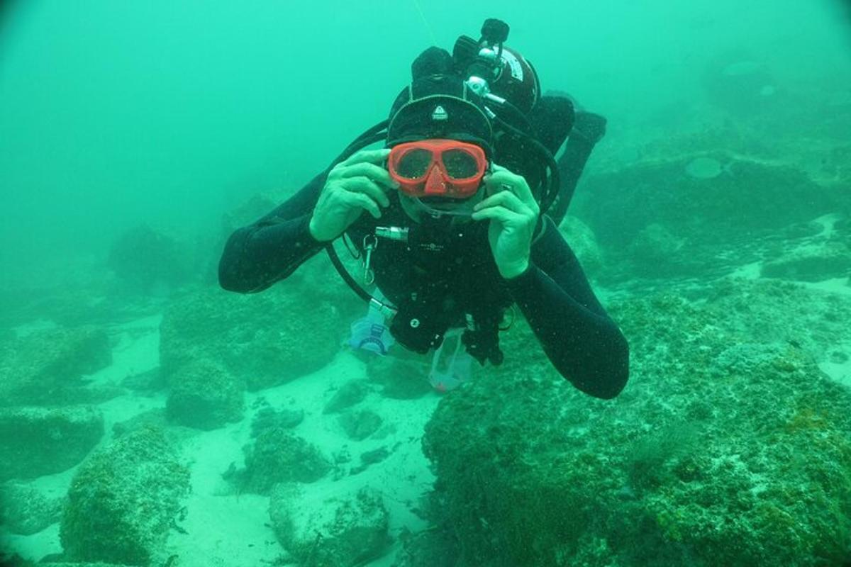 a person is taking a picture of the ocean