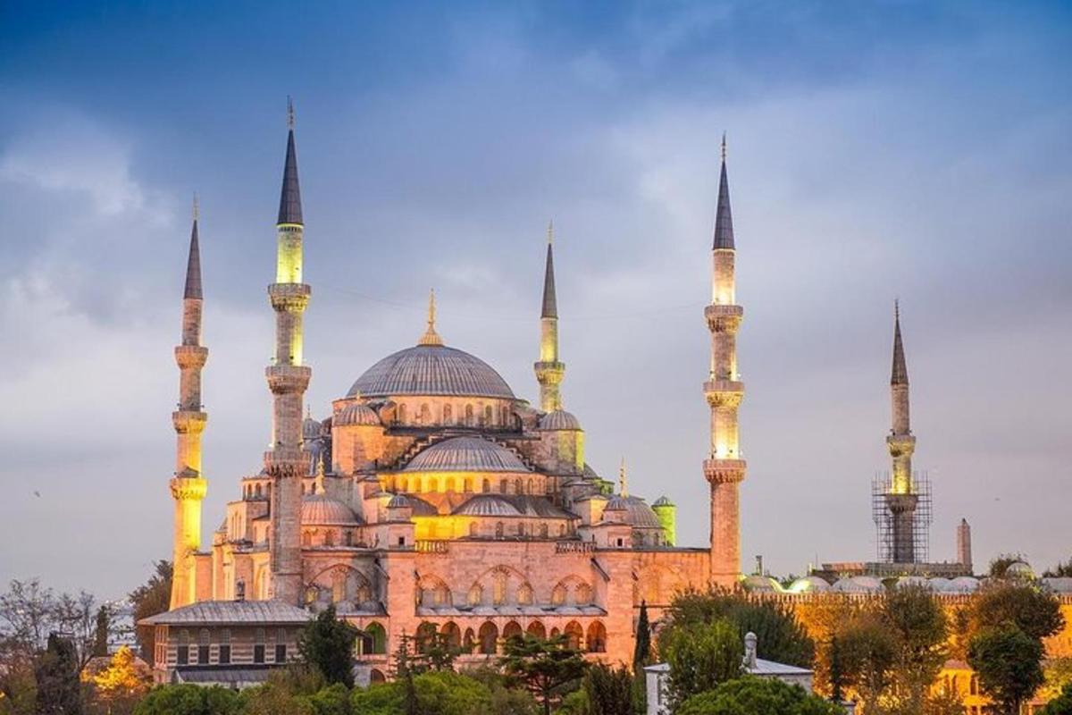 a large building with two mosques with tall domes