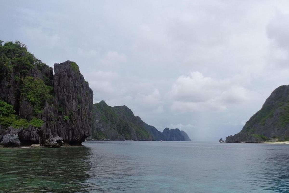 a large body of water with mountains in the background