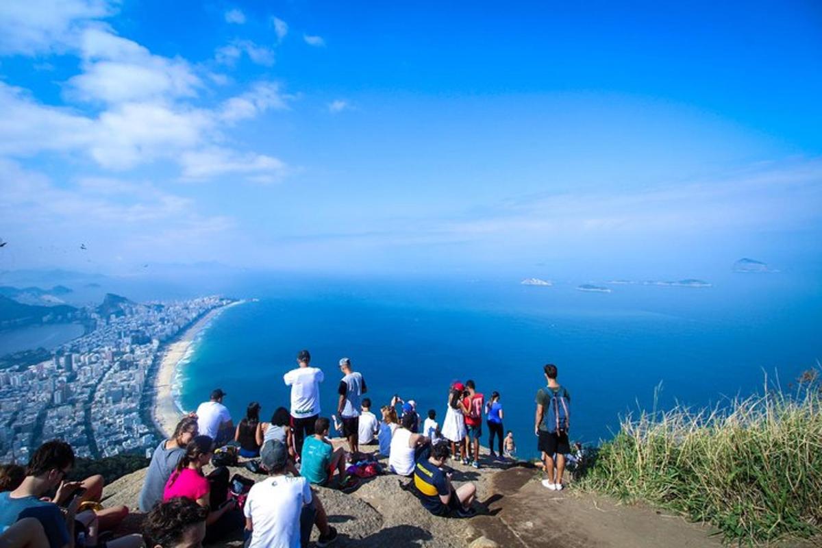 a group of people standing on top of a mountain