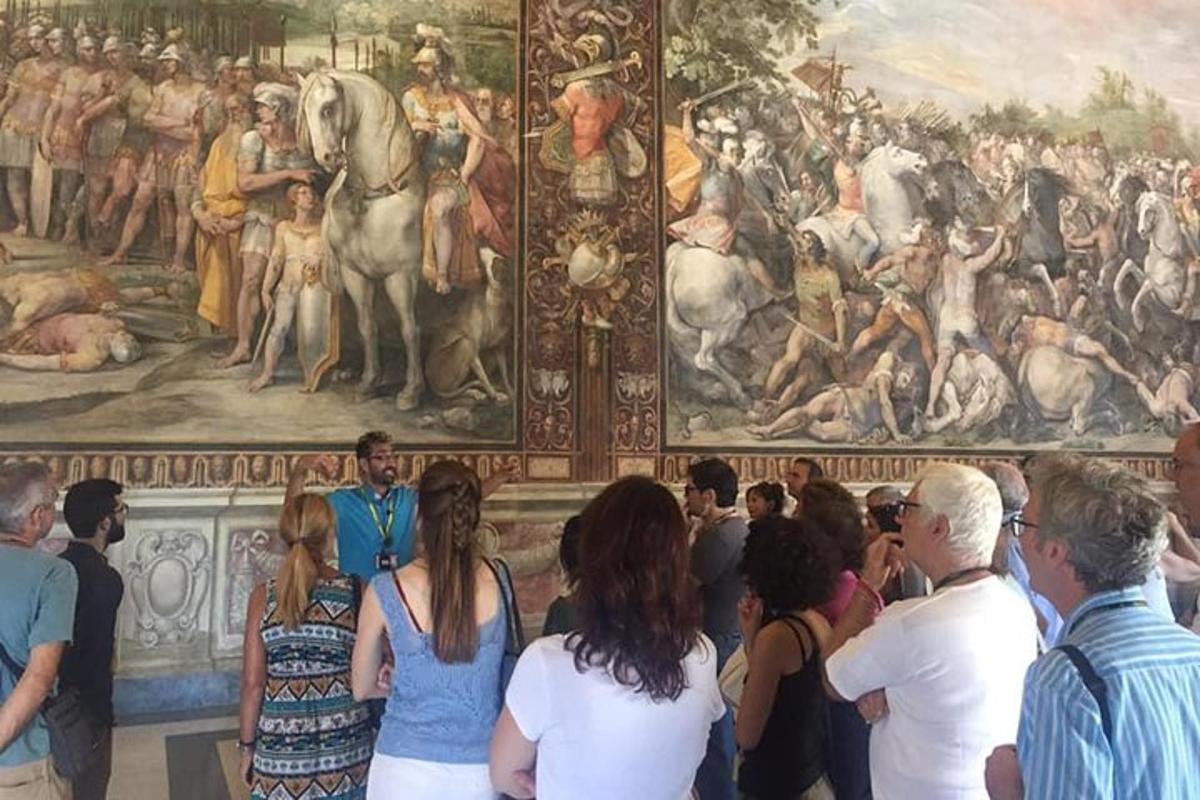 a group of people standing in front of a painting