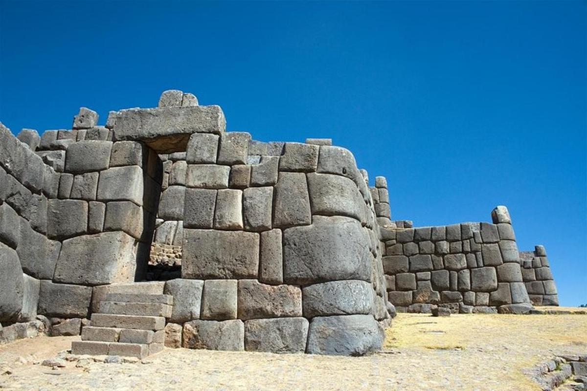 a large stone wall in the desert