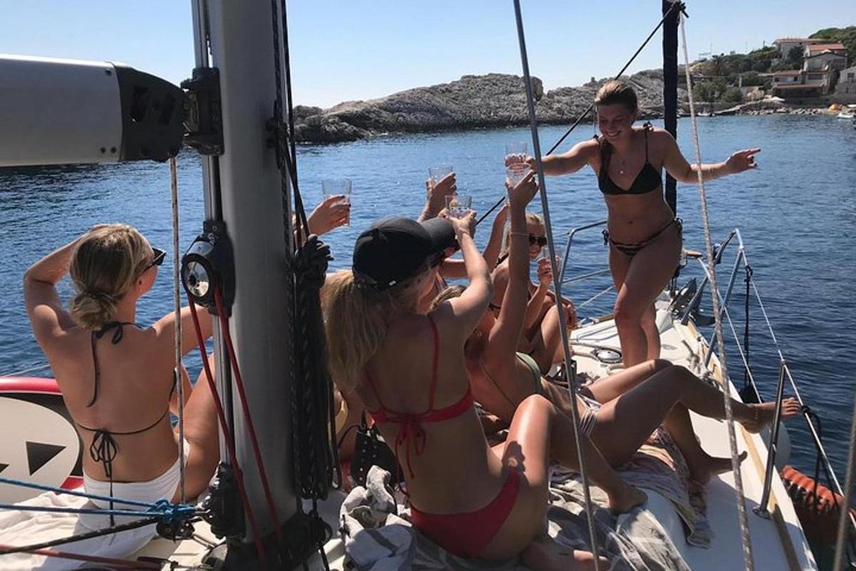 a group of women in bathing suits on a boat