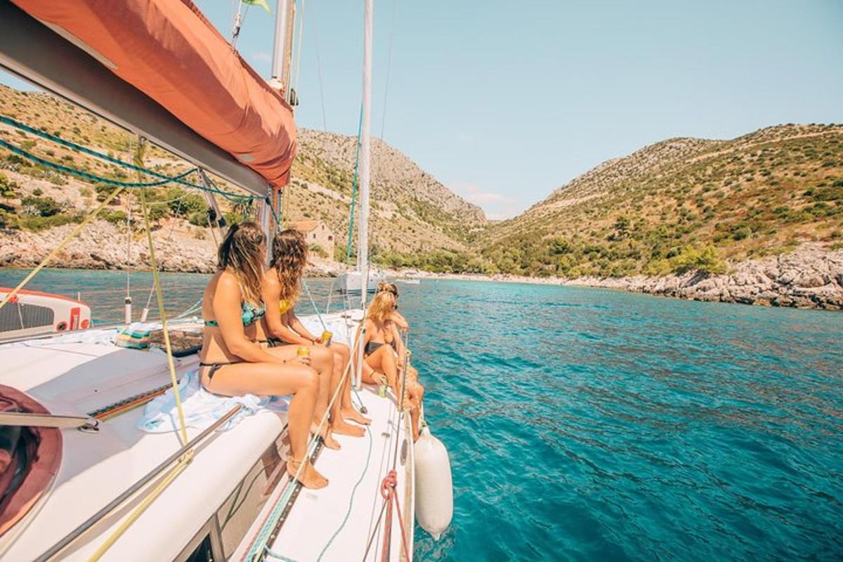 a group of women sitting on a boat in the water