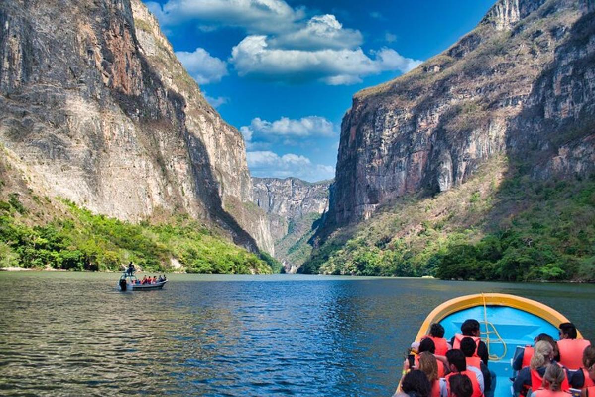 a group of people in a boat on a river