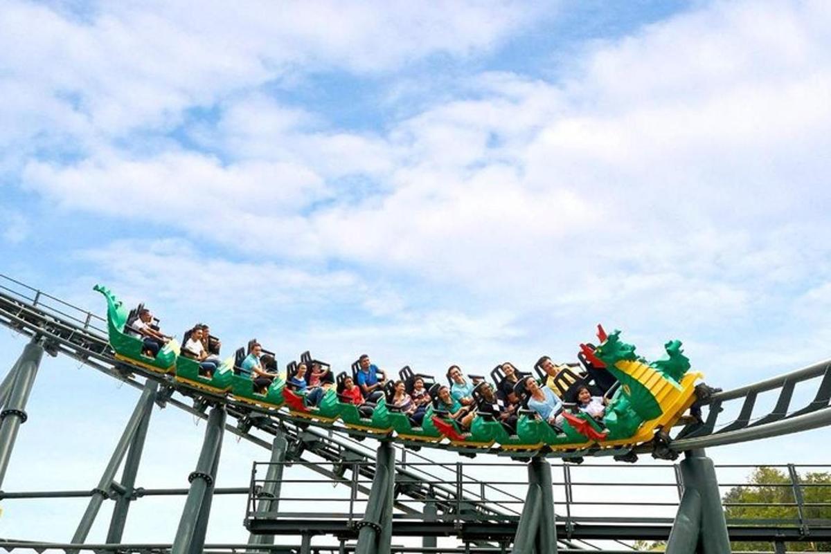 a group of people riding on a roller coaster