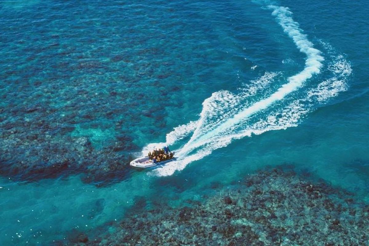 a boat in the ocean with people on it