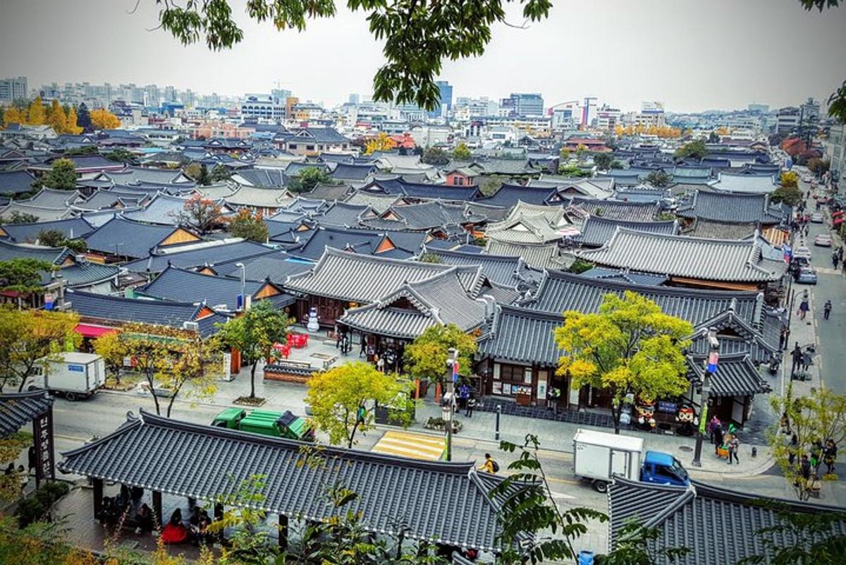 an overhead view of a city with buildings and roofs