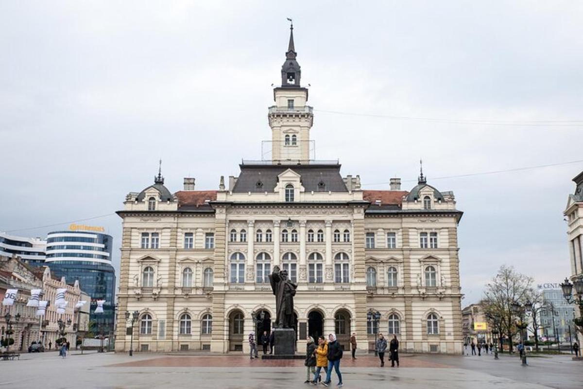 a large building with a statue in front of it