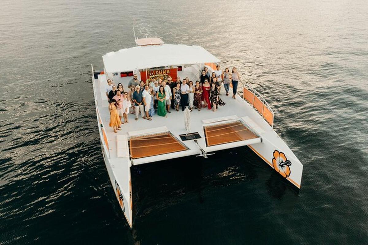 a group of people on a boat in the water