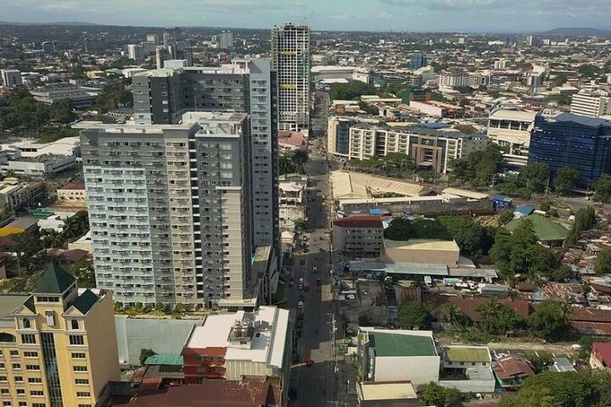 an aerial view of a city with tall buildings