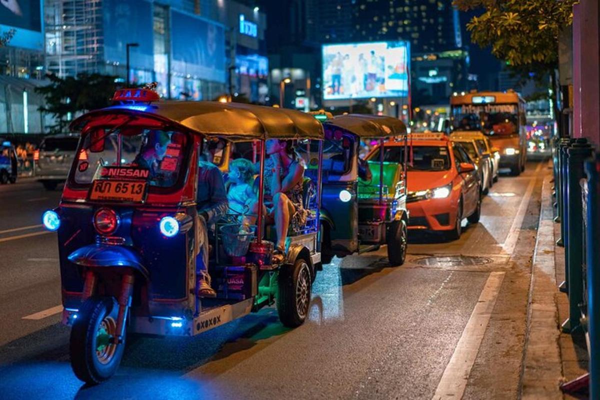 a group of people riding a golf cart on a city street