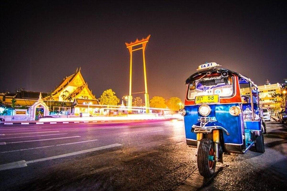 a bus parked on the side of a street at night