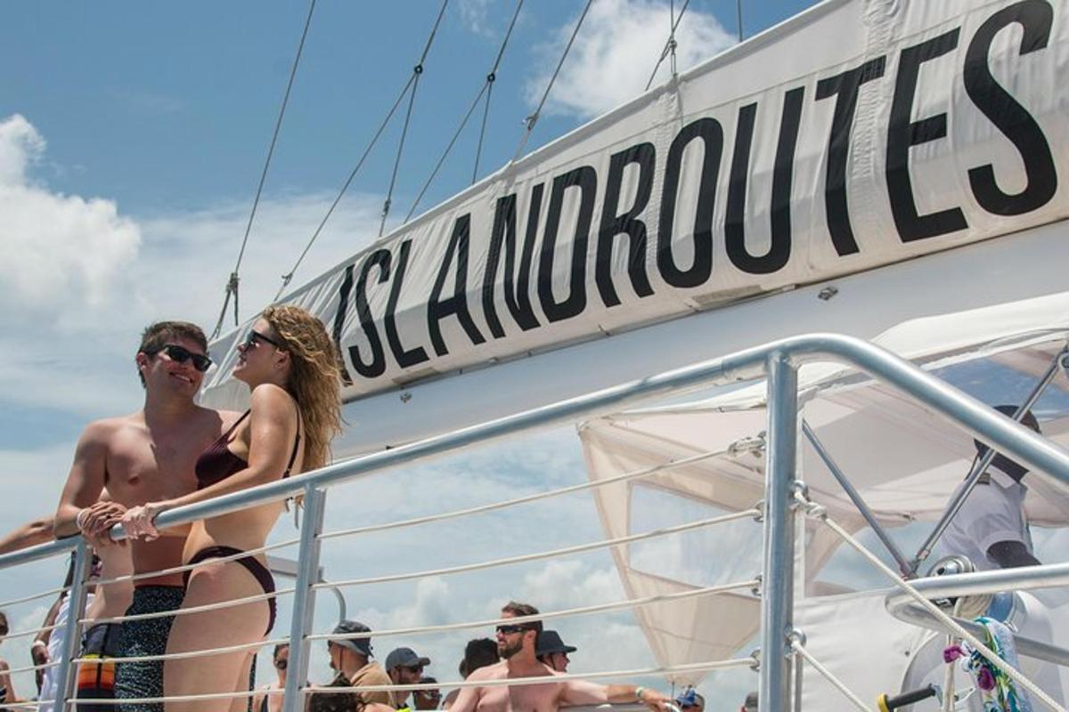 a group of people standing on a boat