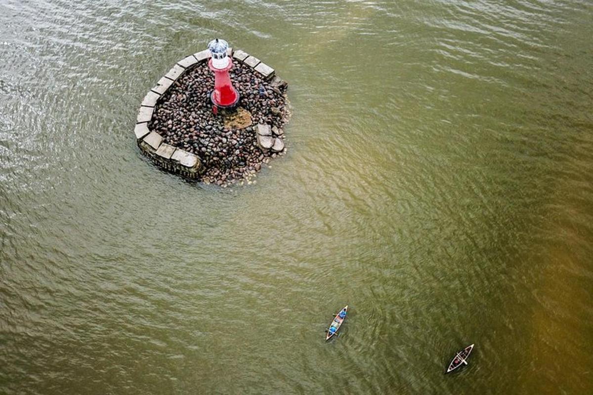 a small island in the water with people on it