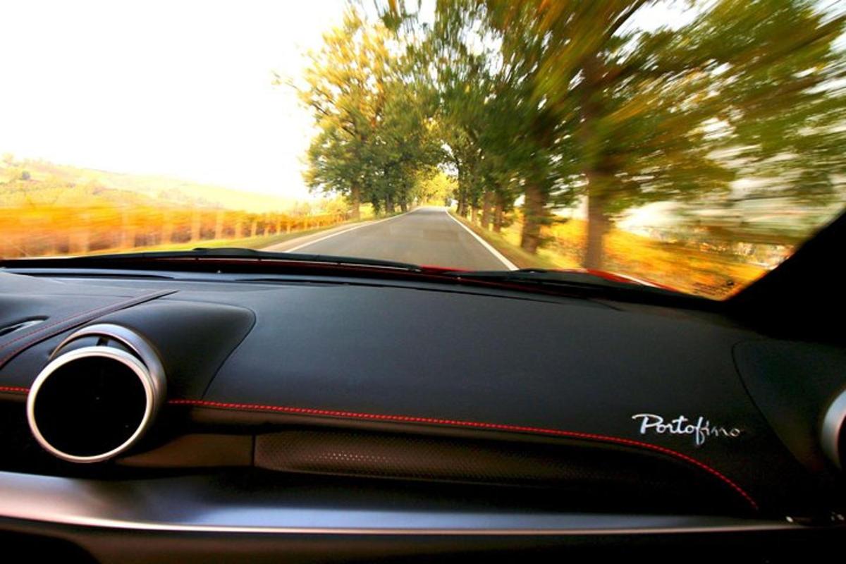 a view of the dashboard of a car on a road