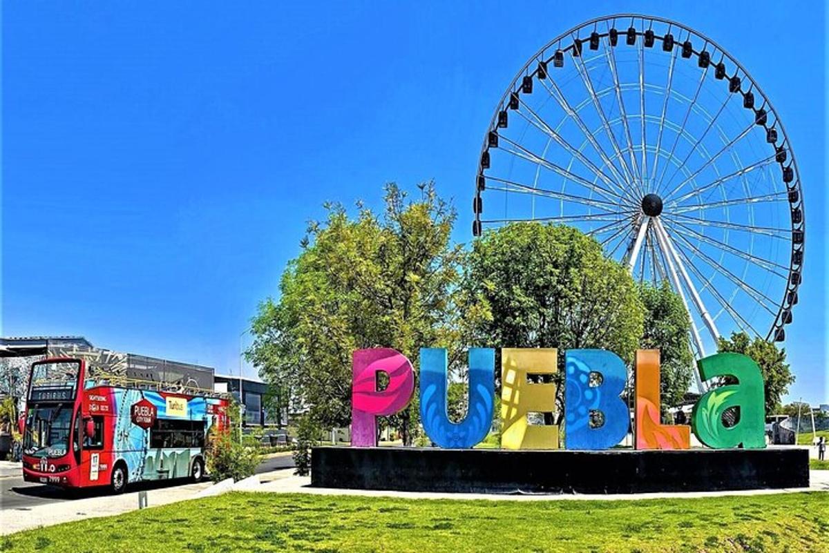 a ferris wheel and a sign in front of a park