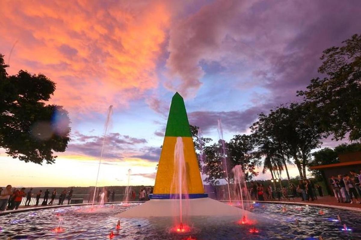a fountain with a christmas tree on top of it