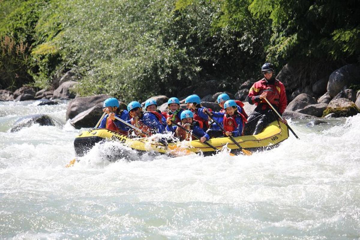 a group of people in a raft on a river
