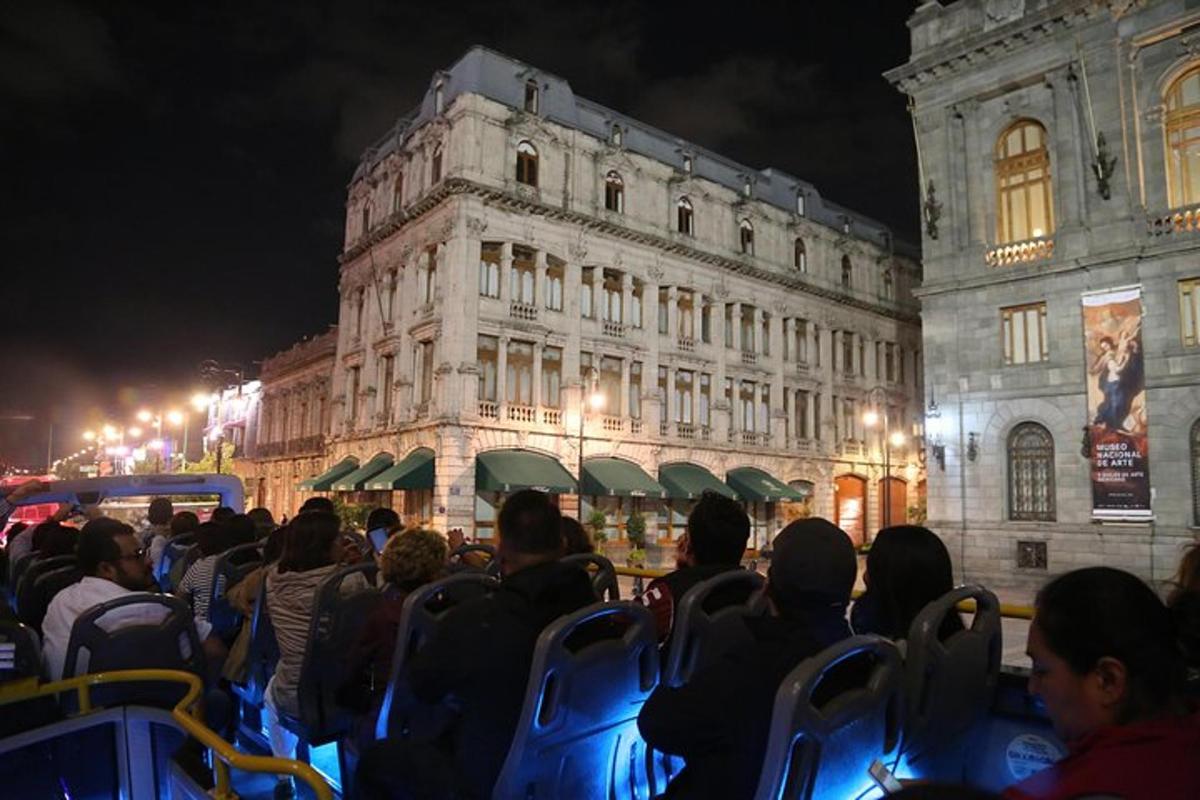 a group of people sitting in chairs in front of a building