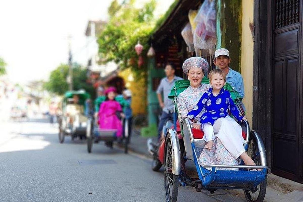 a man and woman riding on a rickshaw with a child