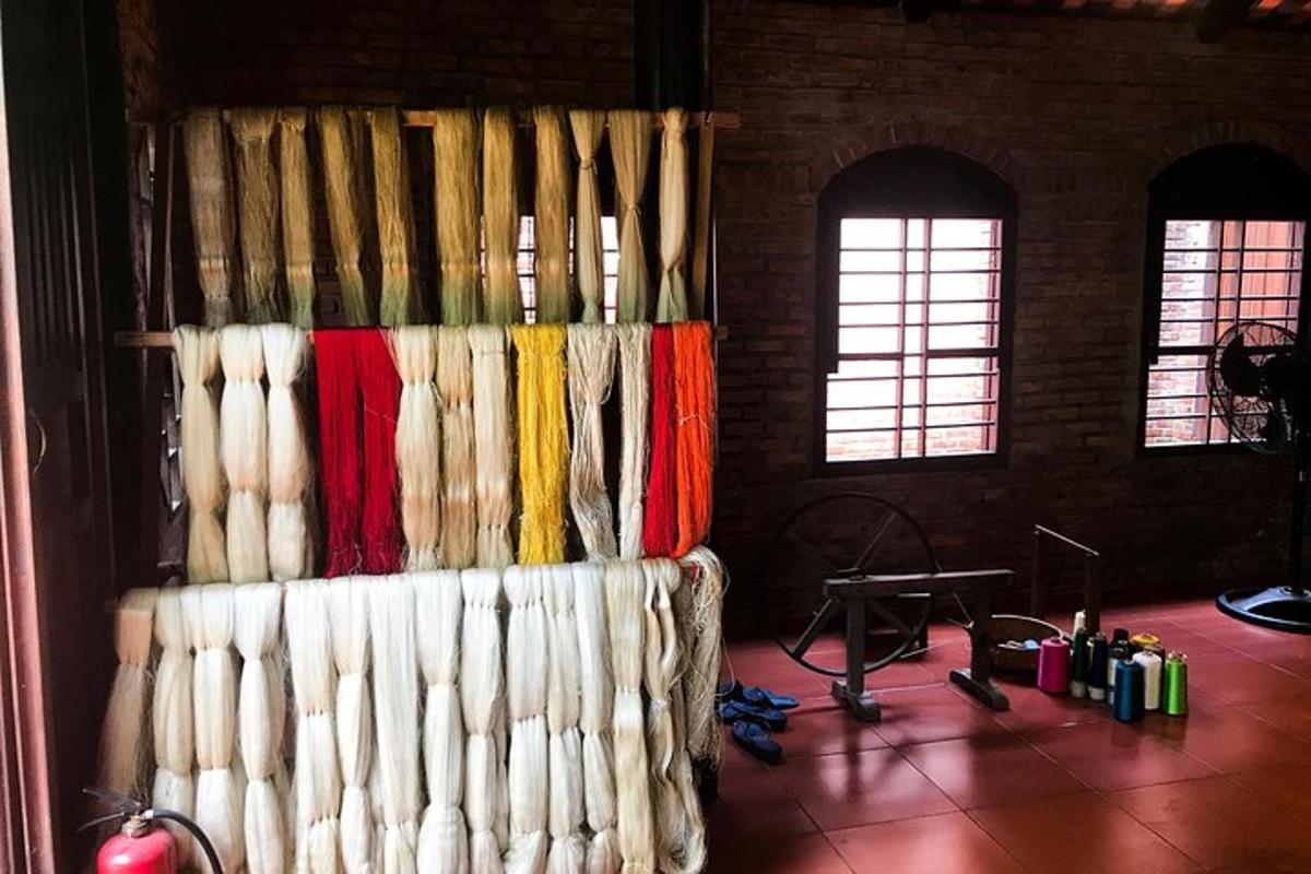 a room with a wall of curtains and a table