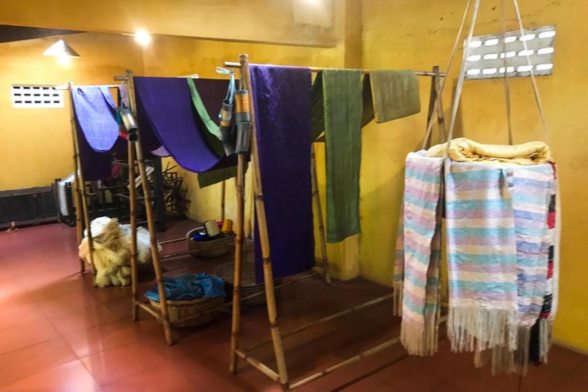 a room with a bunch of clothes hanging up