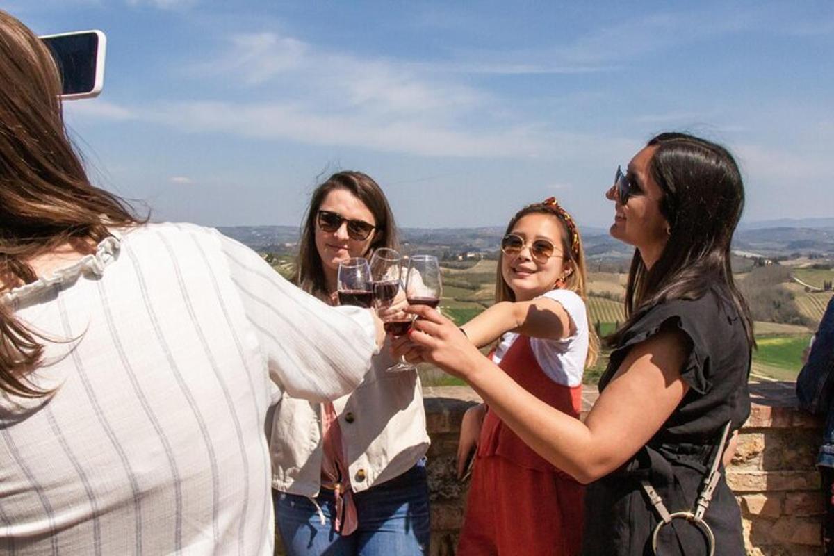 a group of people holding up glasses of wine