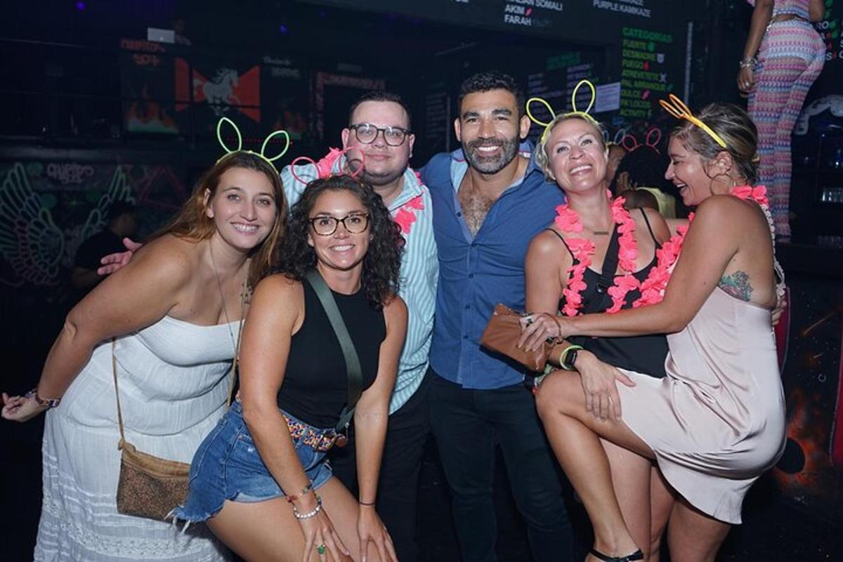 a group of people posing for a picture at a party
