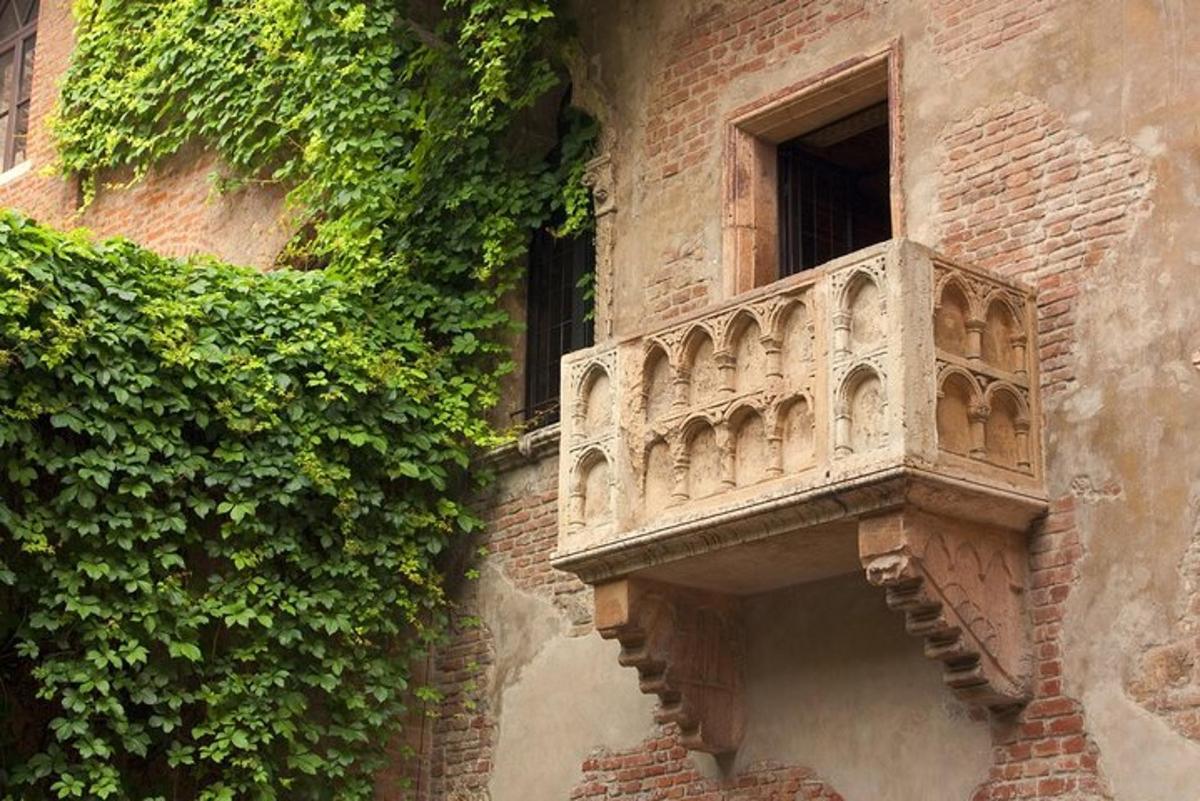 a stone balcony on the side of a building