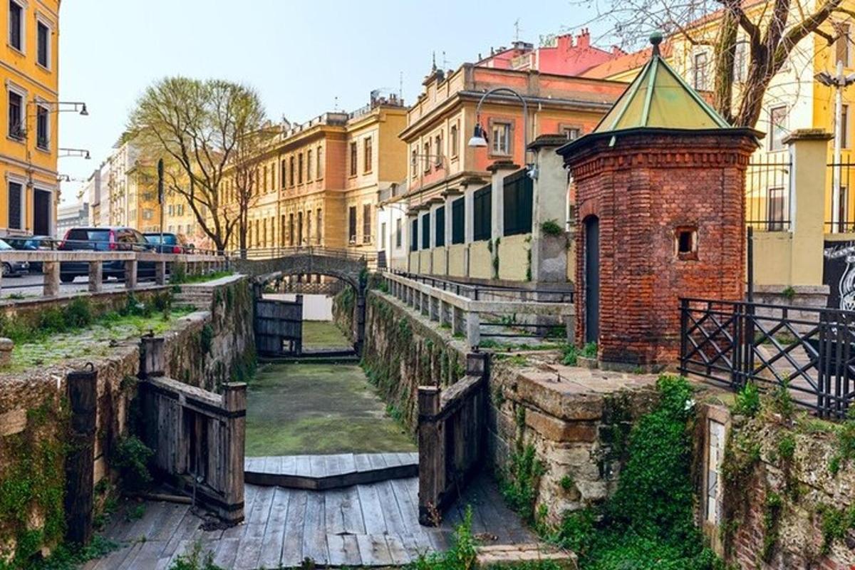 a canal in a city with buildings and a bridge