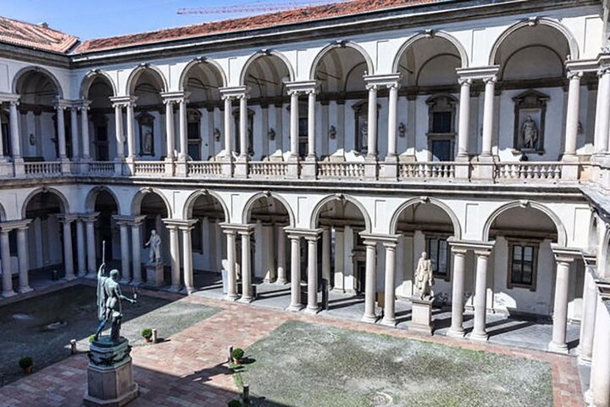 a large white building with columns and a balcony