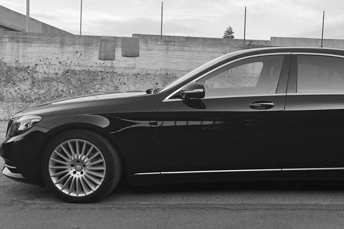 a black car parked in a parking lot