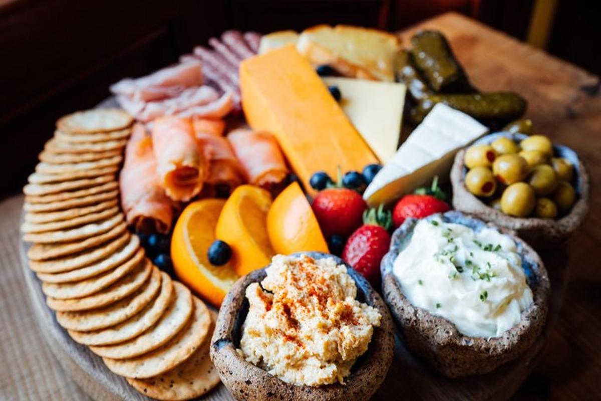 a plate of food with bread and cheese and fruit