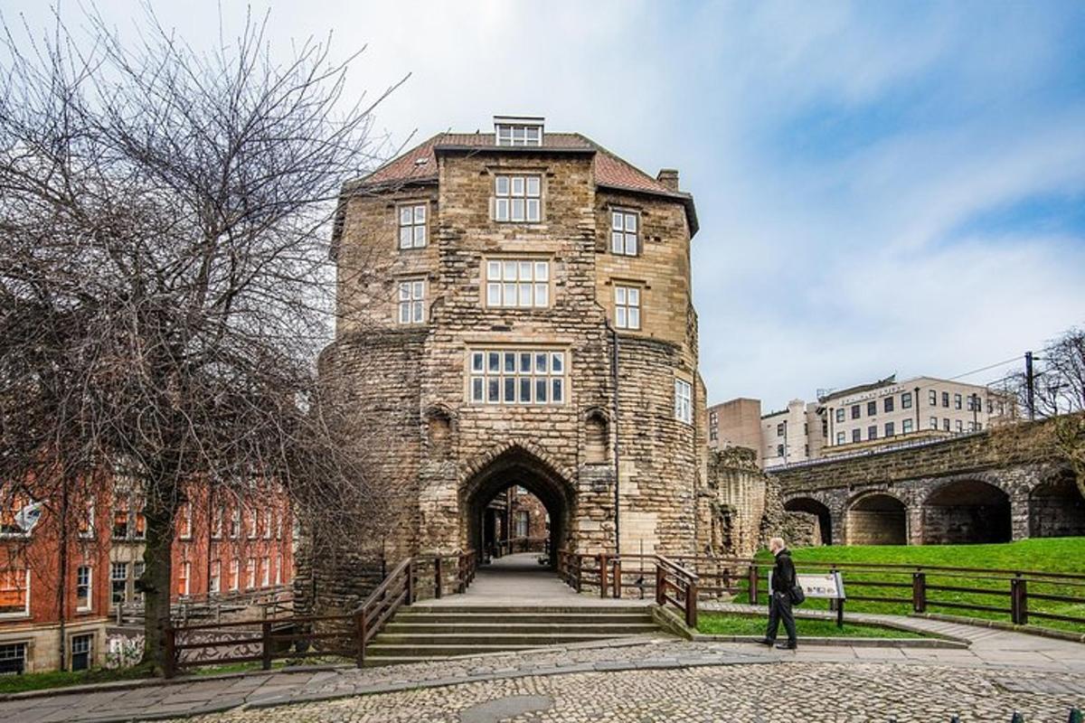 a large stone building with an archway in front