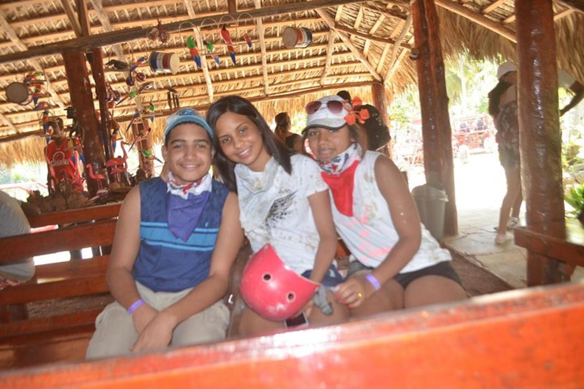 a group of three people sitting on a bench