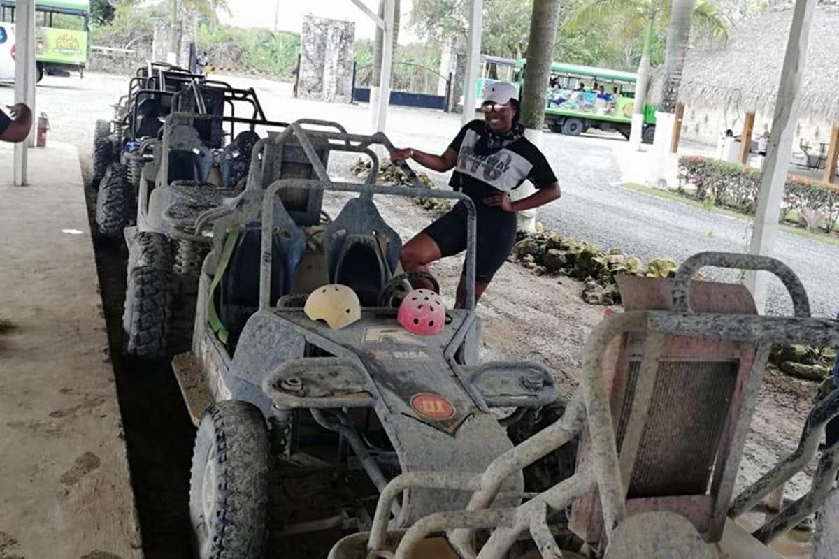 a man is standing next to a four wheeler