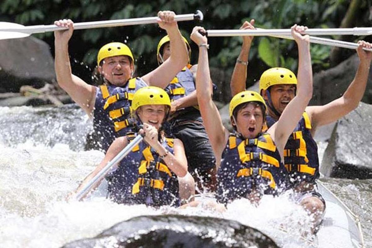 a group of people on a raft in a river