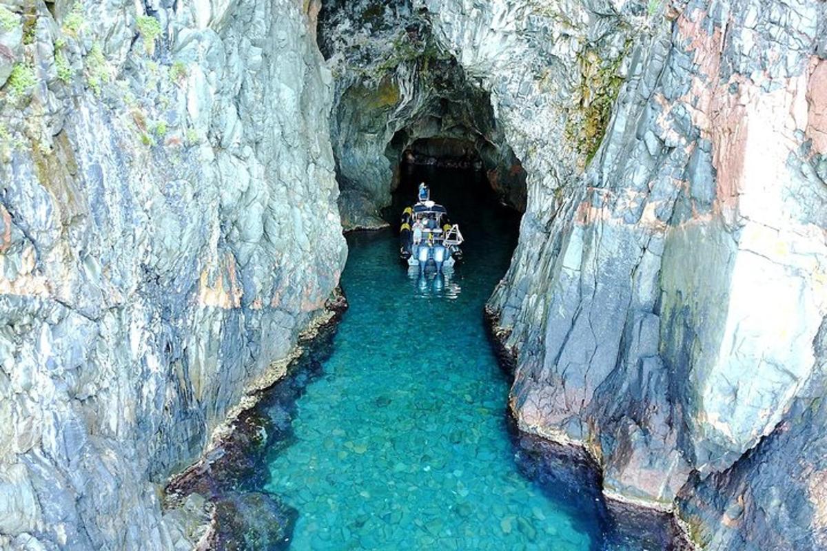 a group of people riding motorcycles through a cave