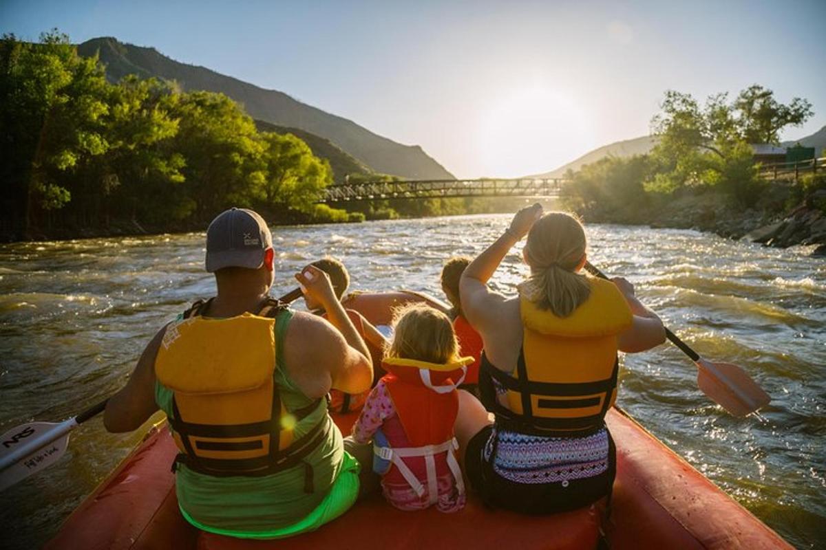 a group of people in a boat on a river