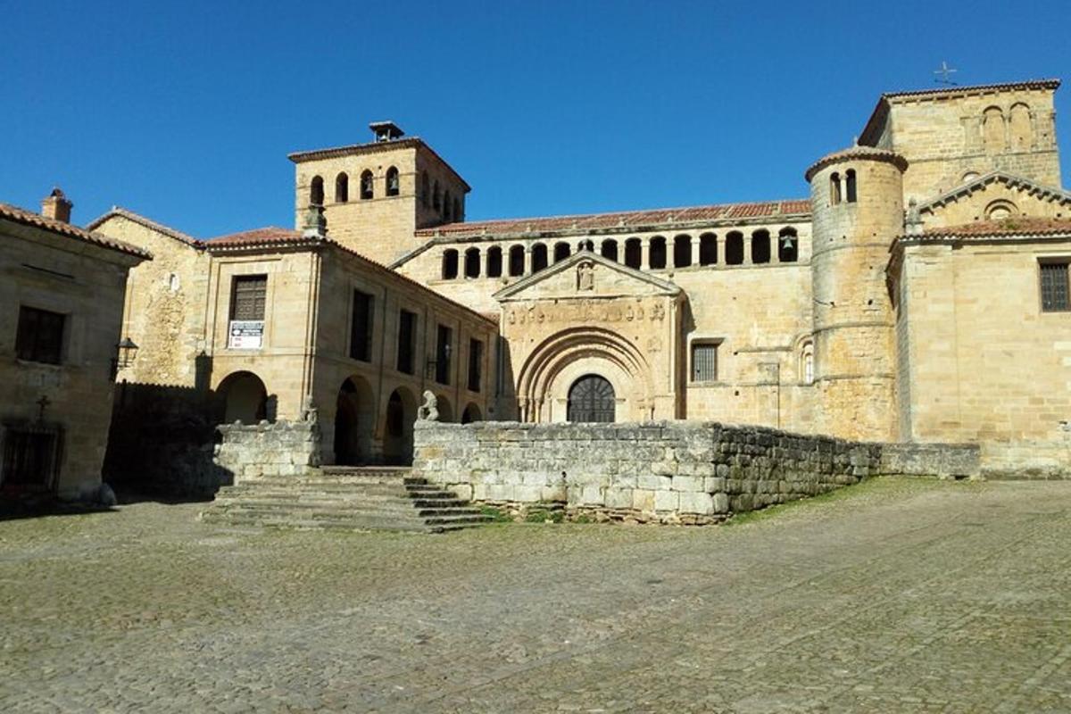 a large stone building with a staircase in front of it