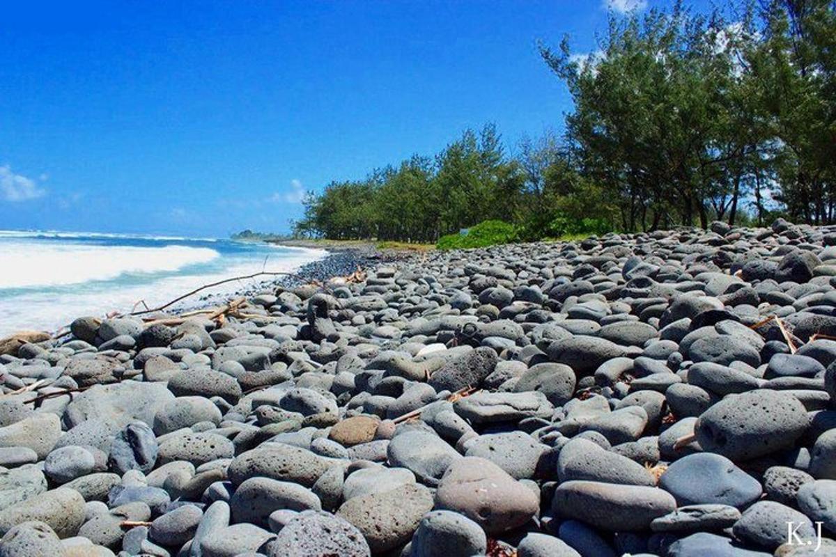 a large pile of rocks on a beach