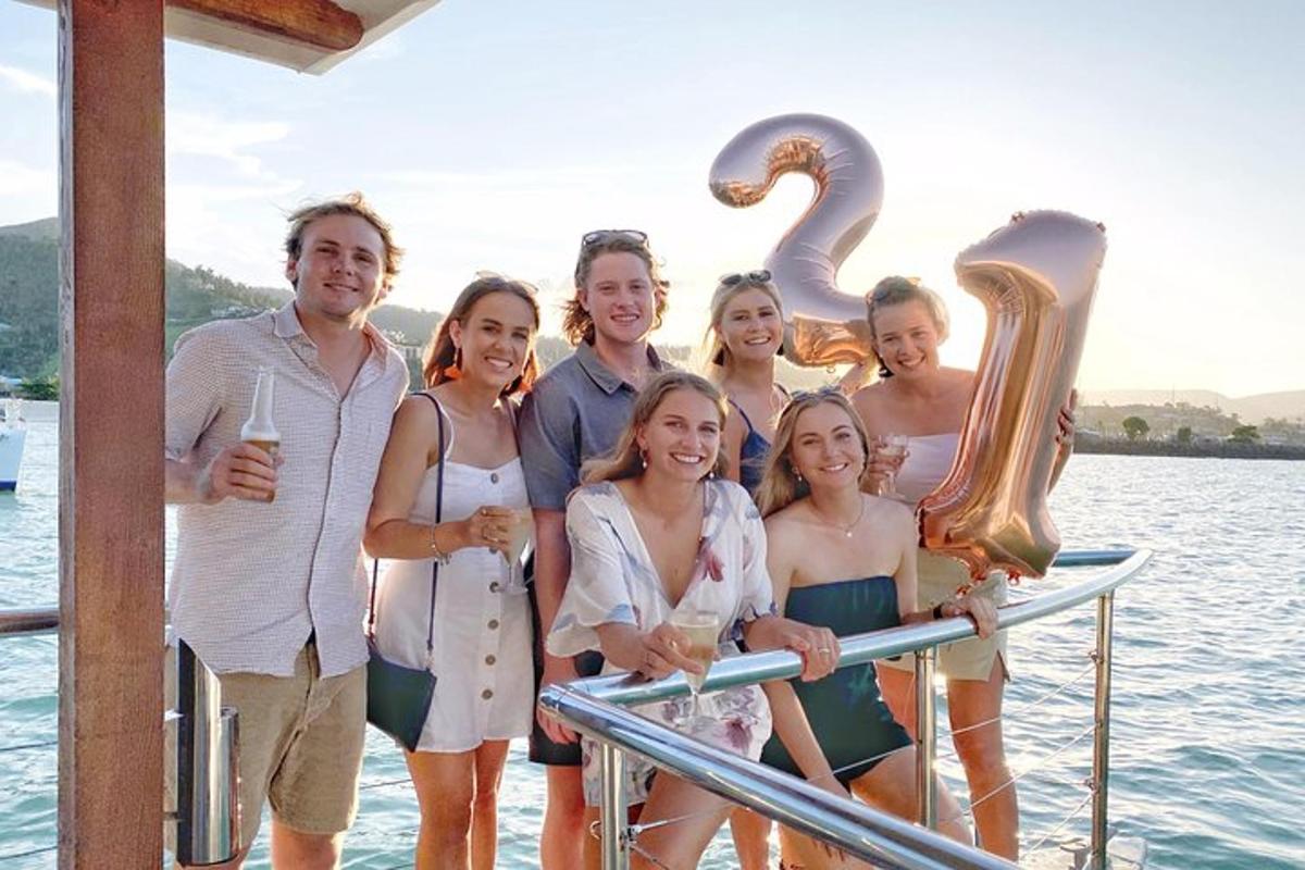 a group of people posing for a picture on a boat