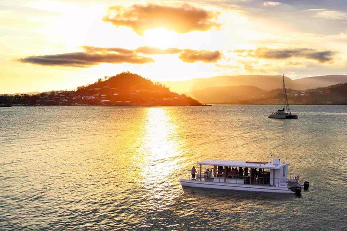 a group of people on a boat in the water