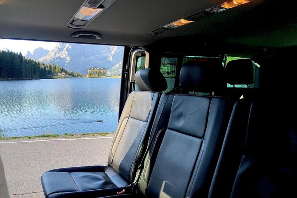 a view of a lake from the back of a van
