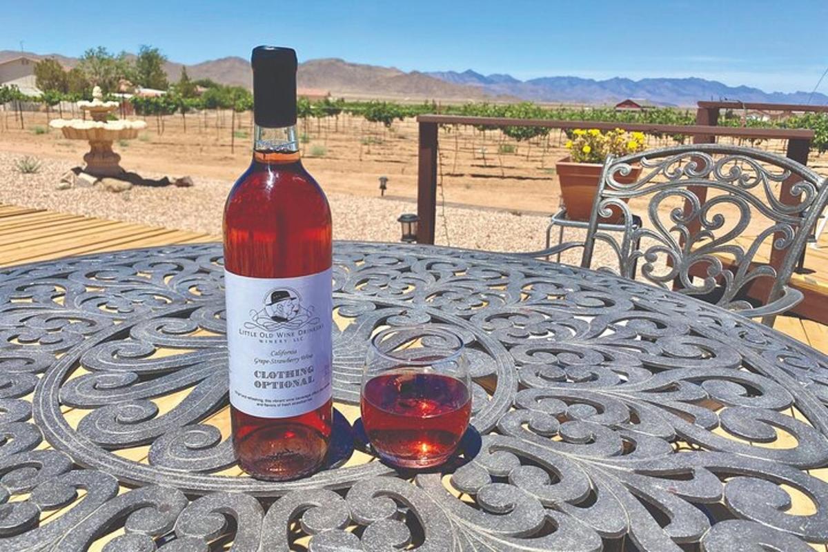 a bottle of wine and a glass on a table