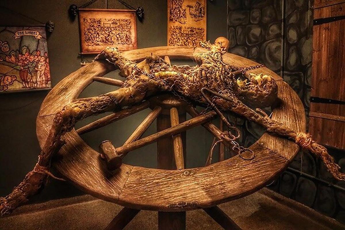 a large wooden wheel in a room