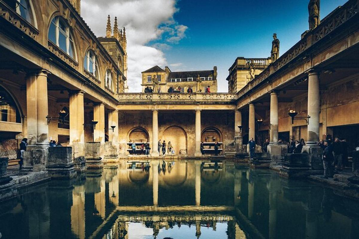 a building with a pool of water in a courtyard