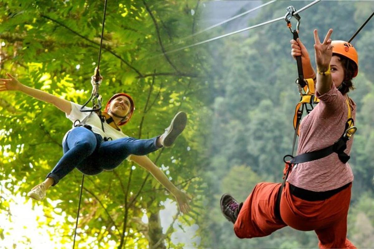 two people on a zip line in the forest